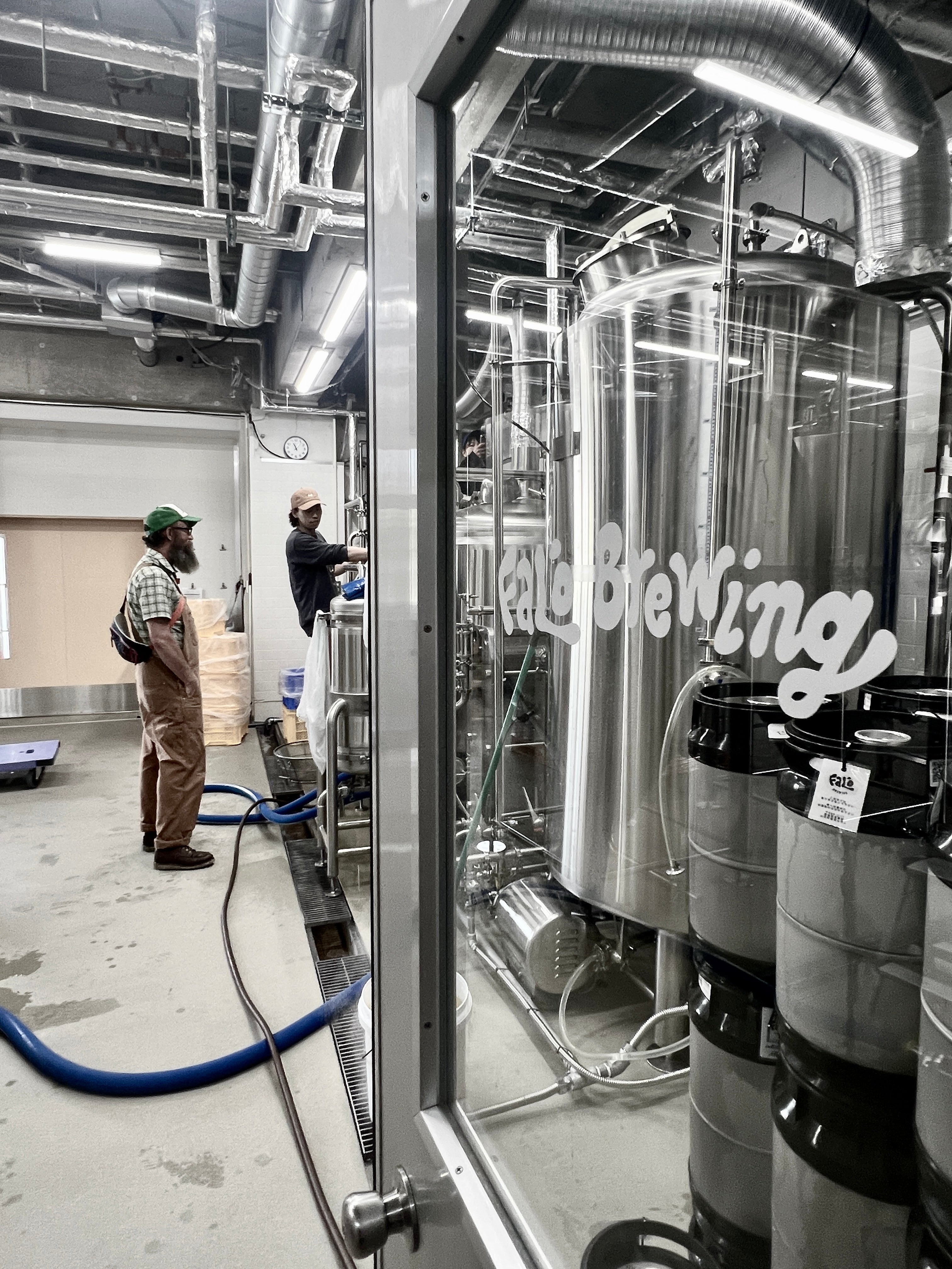 Sailors Grave Brewing Chris and Falo Brewing Naru Handa working together 
at Falo Brewing