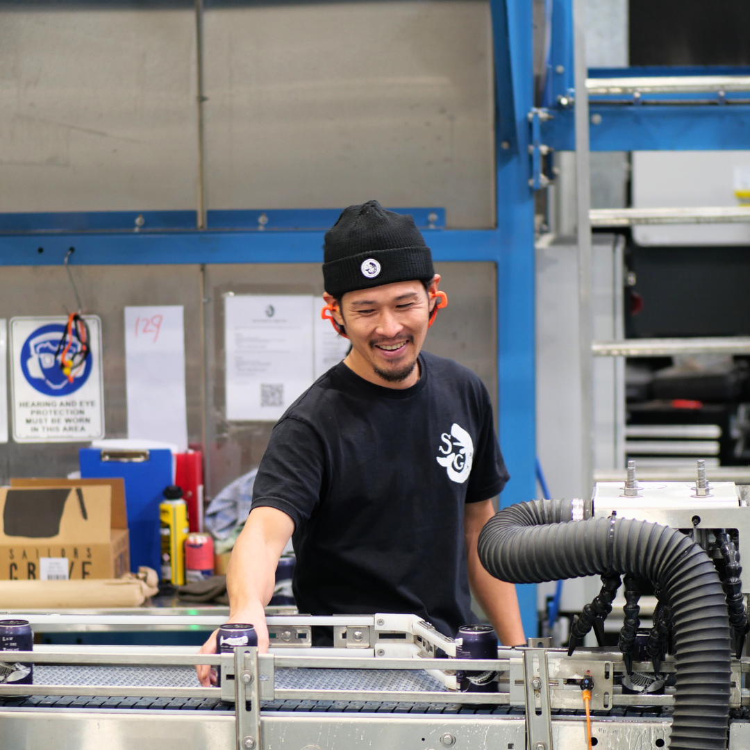 Man working in Sailors Grave brewery with machinery and equipment around